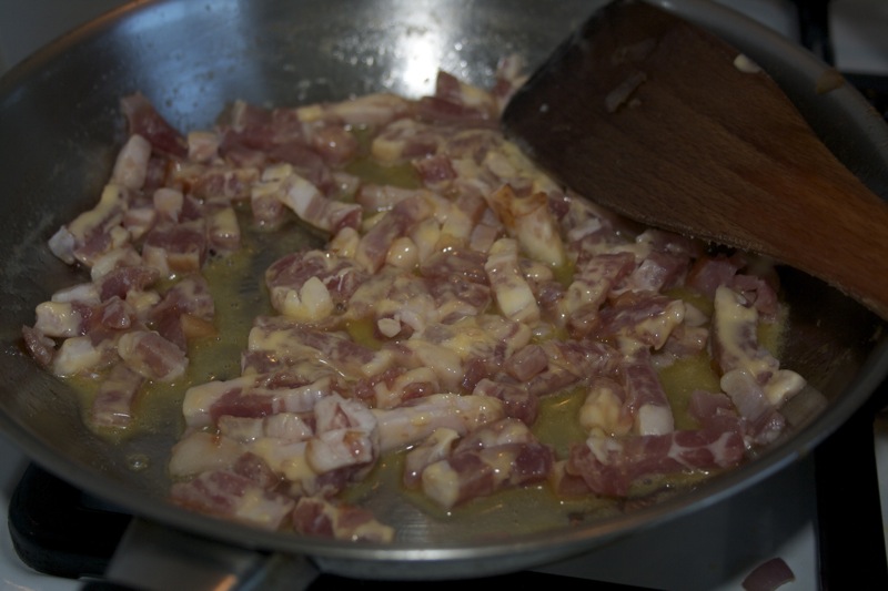 Put the bacon bits in the skillet and slowly cook them